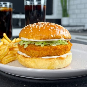 Copycat McChicken served on a toasted brioche bun, with a side of fries and a Coke.