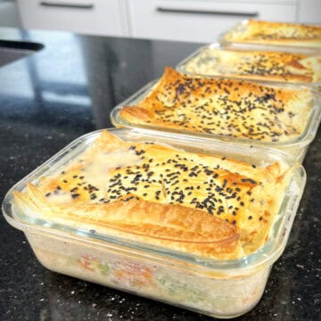 High-protein, low-calorie chicken pot pie in glass meal prep containers.